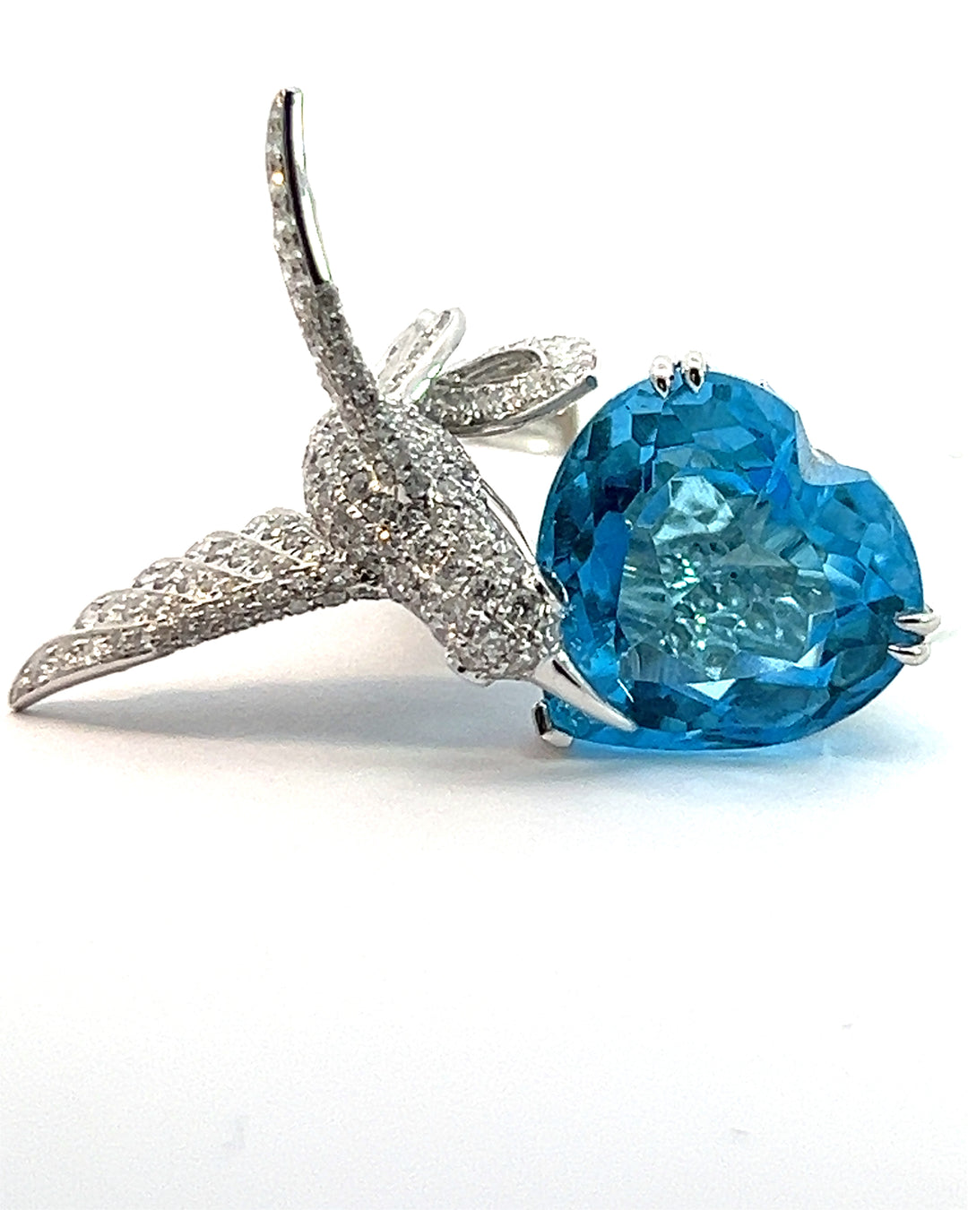 Blue Topaz and diamond humming bird ring