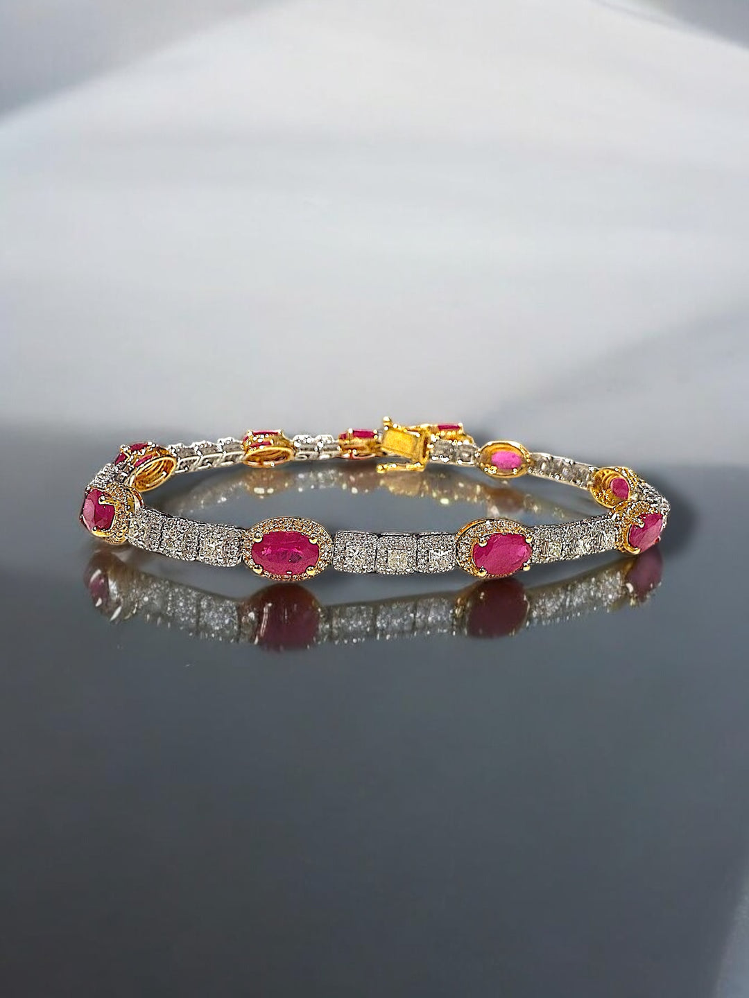 Ruby and diamond yellow and white gold bracelet